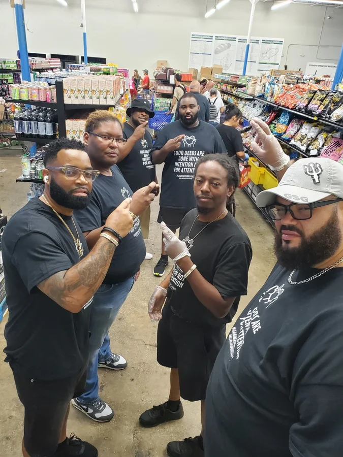 GSG brothers together at a food distribution site